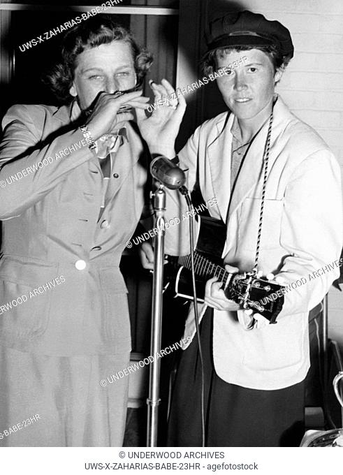 Fresno, California: c, 1948. Babe Didrikson plays harmonica accompanying her good friend Betty Dodd who's playing guitar