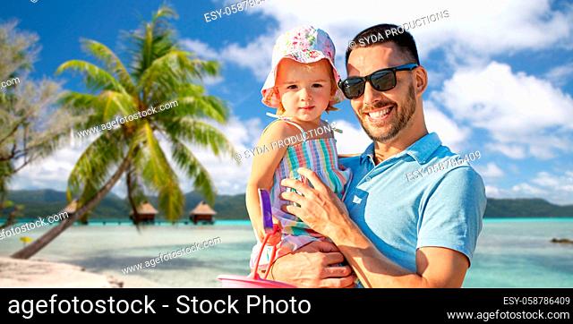 happy father with little daughter on beach