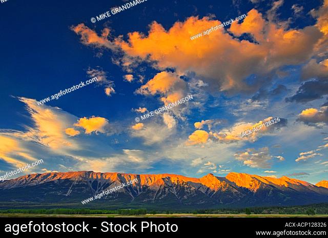 Clouds and The Canadian Rocky Mountains at sunrise. David Thompson Highway Alberta Canada