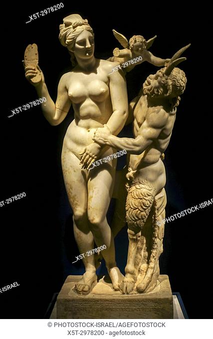 Aphrodite fends off Pan with a sandal while Eros flutters overhead marble statue 100 BCE. National Archaeology Museum, Greece, Athens