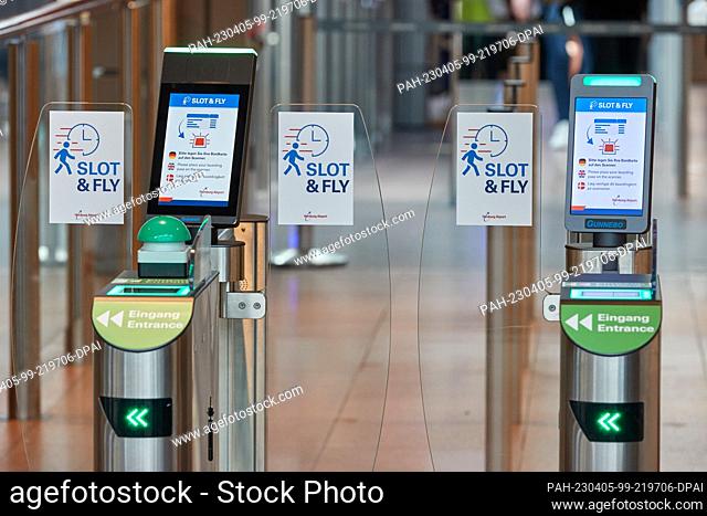 05 April 2023, Hamburg: Signs reading Slot &Fly can be seen at passageways at Hamburg Airport. Hamburg Airport introduced new ""Slot & Fly"" service