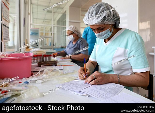 RUSSIA, LUGANSK - JUNE 14, 2023: Nurses fill out the paperwork at the Republican Blood Donor Centre. Alexander Reka/TASS