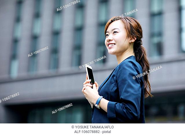 Young Japanese businesswoman downtown