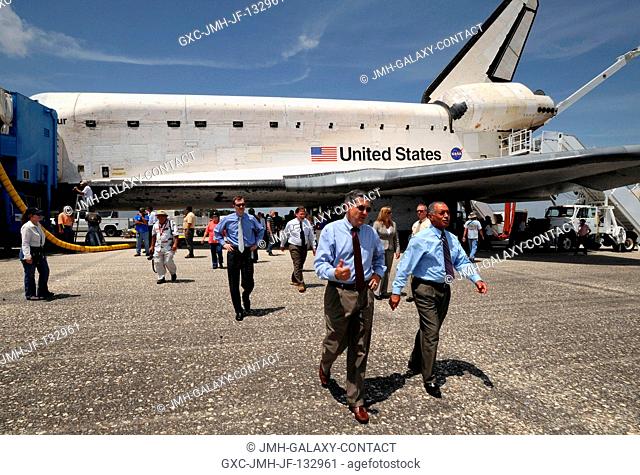 NASA Kennedy Space Center Director Bob Cabana, left, and NASA Administrator Charles Bolden walk to welcome home the crew of the Space Shuttle Endeavour shortly...
