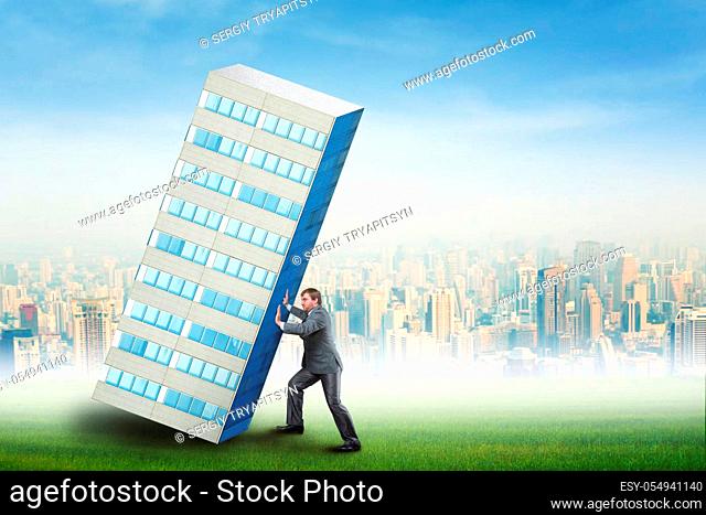 Businessman is constructing a skyscraper