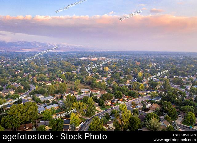 hazy morning with wildfire smoke from Cameron Peak Fire over Fort Collins in northern Colorado, aerial view