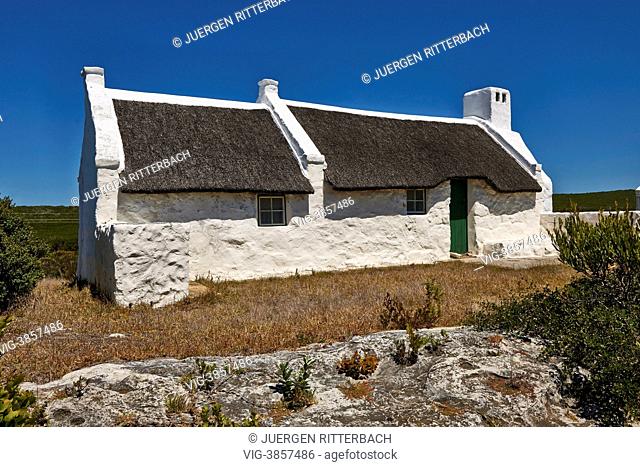 White washed reed thatched roof cottages in Hotagterklip have been designated as national Monuments, Struis Bay, Cape Agulhas, Western Cape