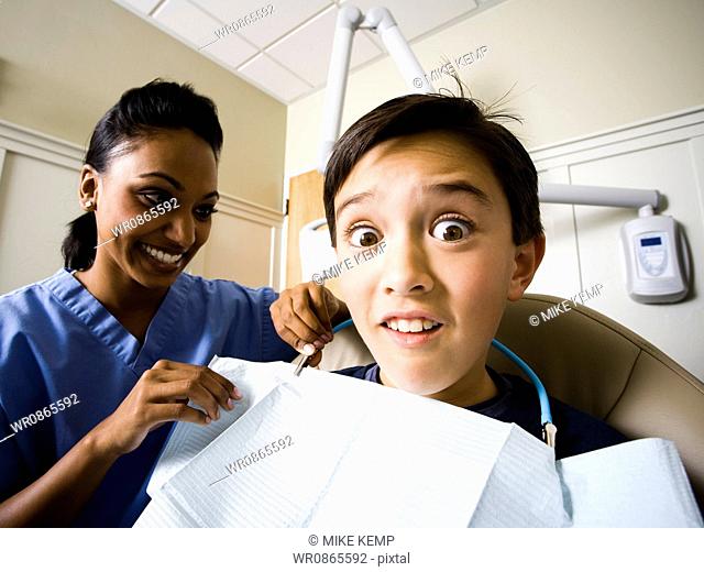 Boy at dentist with hygienist