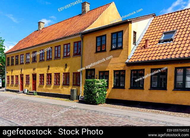 Koge, Denmark - 12 June, 2021- colorful historic houses on a cobblestone street in the old town city center of Koge