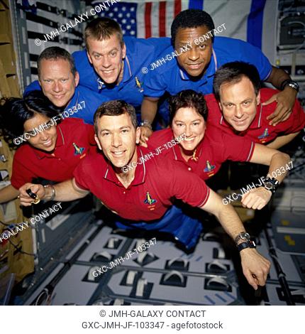 The STS-107 crew members strike a 'flying' pose for their traditional in-flight crew portrait in the SPACEHAB Research Double Module (RDM) aboard the Space...