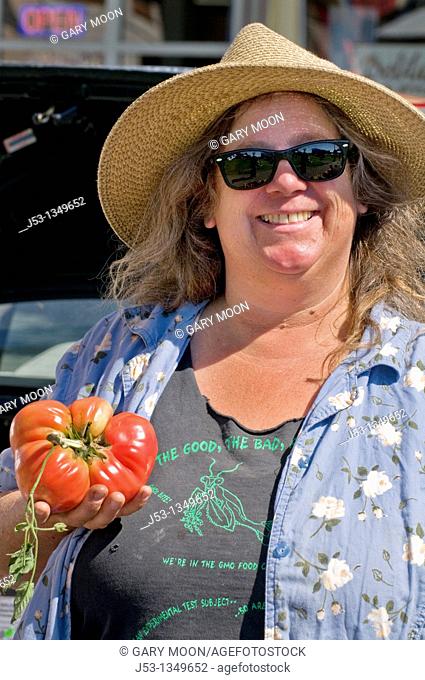 Woman farmer at farmers' market, downtown Arcata, California