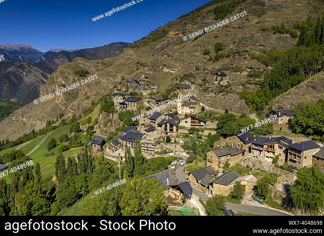 Aerial view of the town of Burg and the surrounding green fields in Coma de Burg (Pallars SobirÃ , Lleida, Catalonia, Spain, Pyrenees)