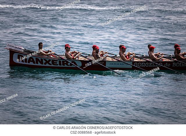 CASTRO URDIALES, SPAIN - JULY 15, 2018: Competition of boats, regata of trainera, Cabo boat in action in the VI Bandera CaixaBank competition