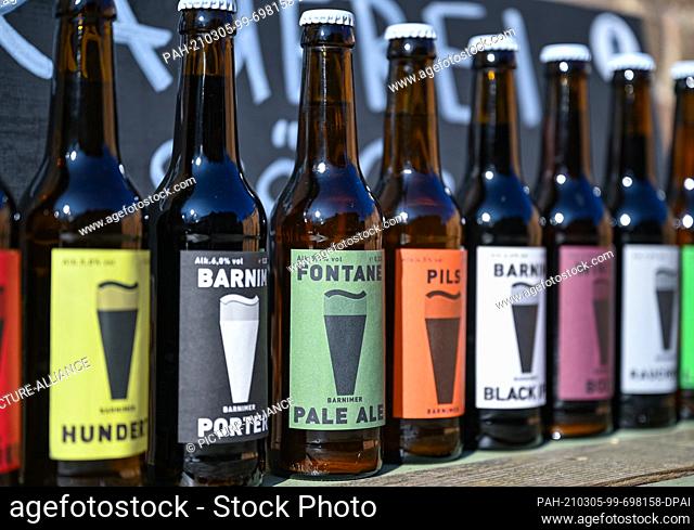 02 March 2021, Brandenburg, Hohenfinow: Various types of beer from the Barnimer Brauhaus. Nora and Sören von Billerbeck are trained classical singers - and...