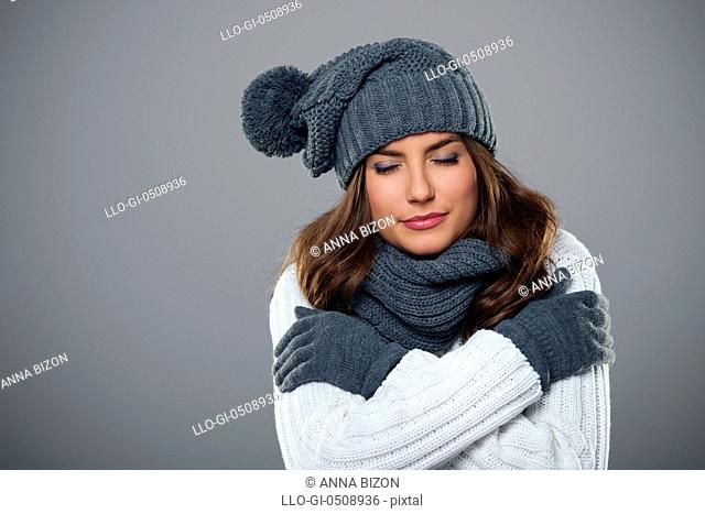 Young woman shivering during the winter season Debica, Poland