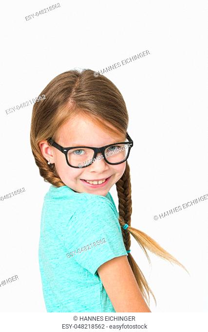 pretty girl with black glasses and plaits in front of white background in the studio