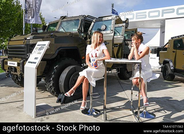 RUSSIA, MOSCOW REGION - AUGUST 14, 2023: Participants are seen by a Buran armoured vehicle at the Army 2023 International Military and Technical Forum at the...