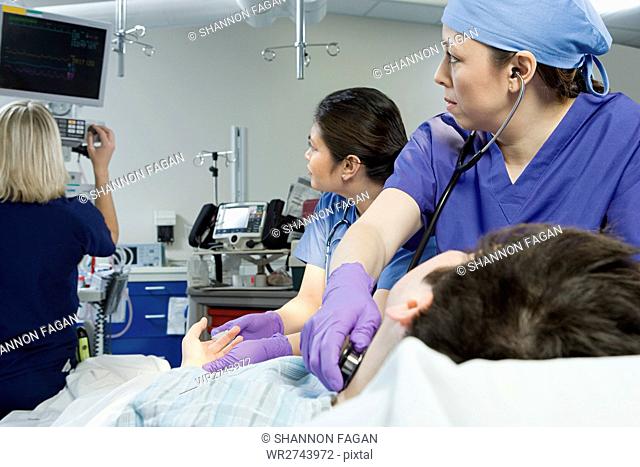 Surgeons checking patient