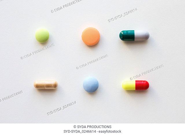different pills and capsules of drugs