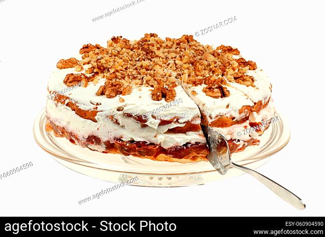 Delicious cake with apple and whipped cream filling, topped with nuts