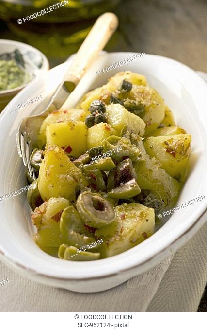 Spicy fried potatoes with olives and capers