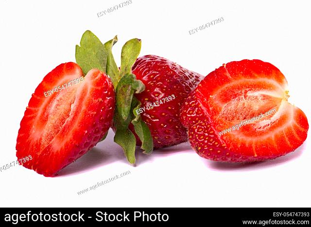 Close view of a bunch of strawberry fruits isolated on a white background