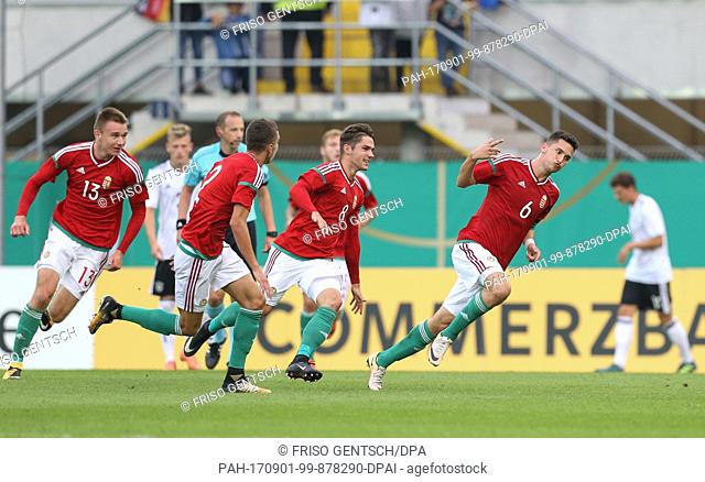 Mate Vida (R) from Hungary celebrates his goal that gives his team a 0:2 lead during the Under 21 test match between Germany and Hungary in the Benteler Arena...