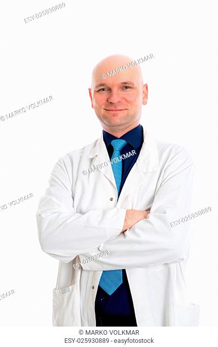 friendly young doctor with crossed arms in front of white background
