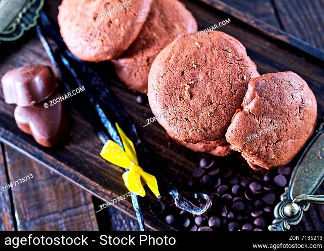 cookies on wooden tray and on a table