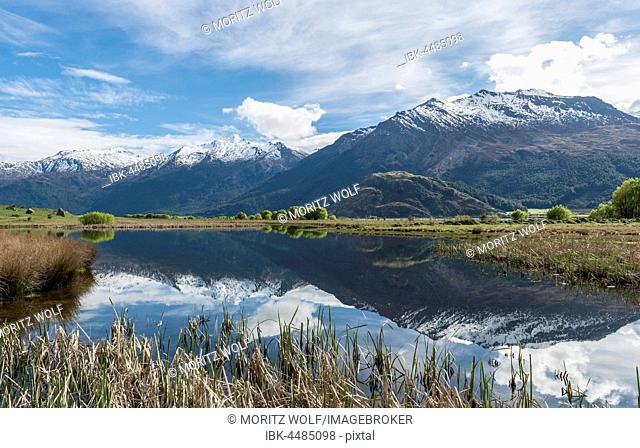 Mountain range reflected in a lake, Matukituki Valley, Mount Aspiring National Park, Otago, Southland, New Zealand