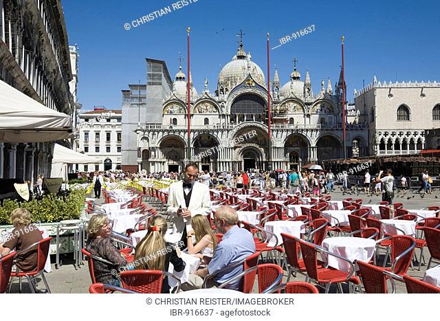 Piazza San Marco Square, street cafe and St Mark's cathedral, Venice, Veneto, Italy, Europe