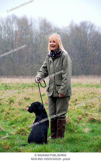 Picker up with her labrador on a pheasant shoot