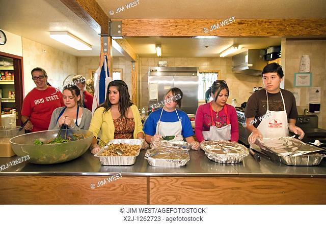 Alamosa, Colorado - High school students from First United Methodist Church in Chula Vista, California cook and serve a meal at a homeless shelter operated by...