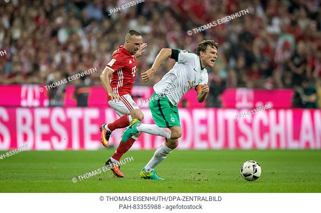 Bayern's Franck Ribery (red) and Bremen's Clemens Fritz in action during the Bundesliga soccer match between FC Bayern Munich and SV Werder Bremen at Allianz...
