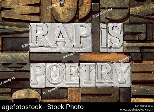 rap is poetry phrase made from metallic letterpress blocks in mixed wooden letters