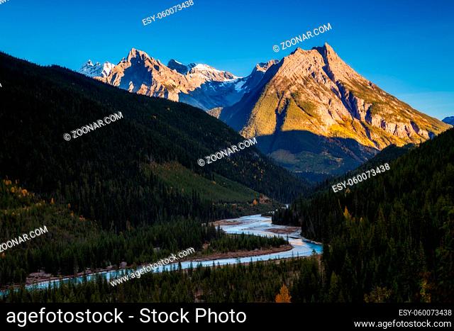 A mountain and river in the Canadian Rockies, British Columbia, Canada at sunset