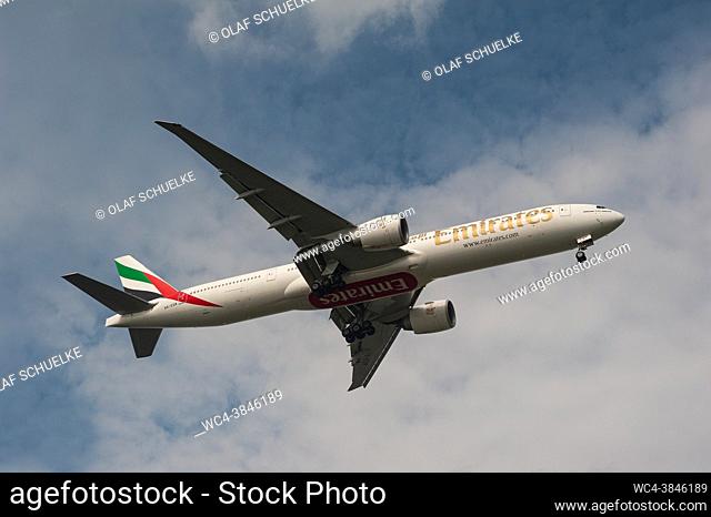 Singapore, Republic of Singapore, Asia - An Emirates Airline Boeing 777-300 ER passenger jet with the registration A6-EQN approaches Changi International...