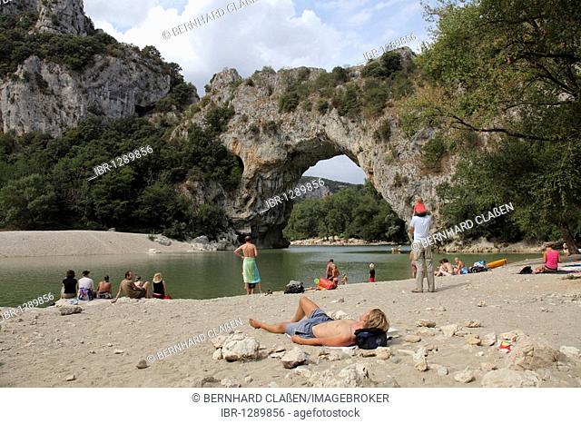 Tourists at the Pont d'Arc, a natural stone bridge over the River Ardèche, Vallon-Pont d'Arc, Ardeche, France, Europe
