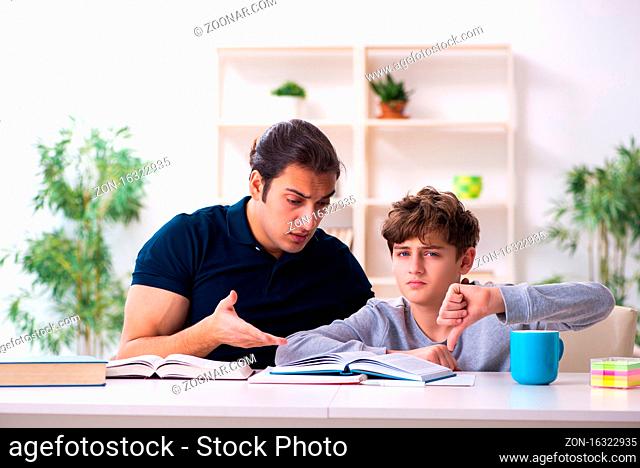 Father and son in the exam preparation concept