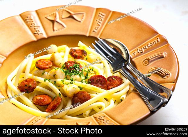 macaroni with sausage and chopped parsley