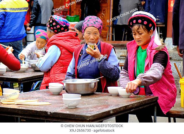 Women eating lunch, Dali Bai Autonomous Prefecture of Dali, Yunnan, China