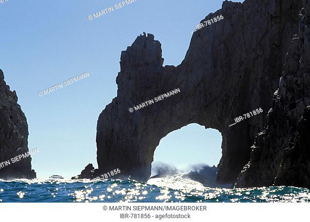 Waves crashing beneath the El Arco rock arch in the cliffs of Cabo San Lucas, Baja California Sur, Mexico