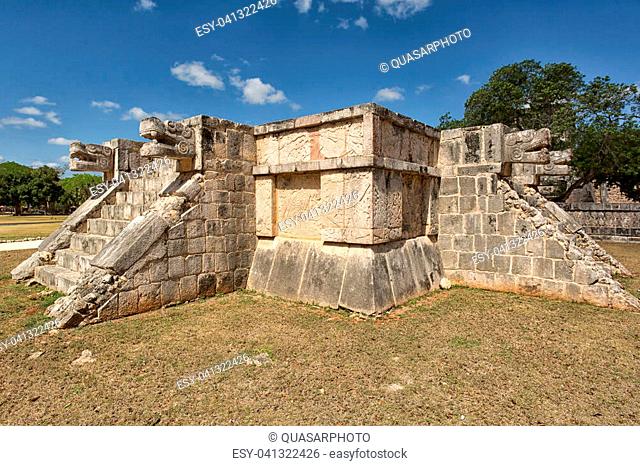 architectural details of a small structure decorated with carvings at Chichen Itza archaeological site in Yucatan Mexico