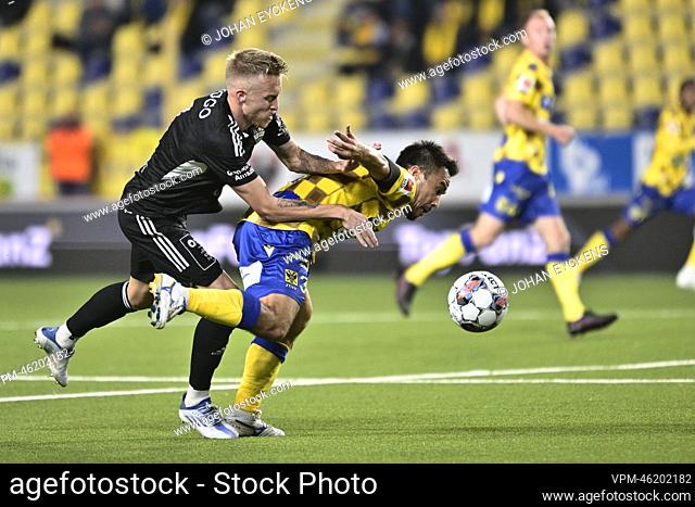 Eupen's James Jeggo and STVV's Shinji Okazaki fight for the ball during a soccer match between Sint-Truidense VV and KAS Eupen