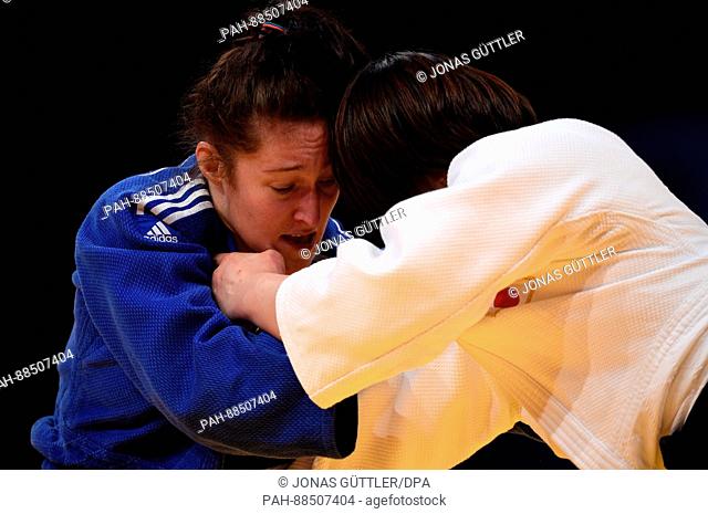 Rika Takayama (white, Japan) and Natalie Powell (blue, Great Britain) in action in the women's above 78 kg body weight competition at the Judo Grand Prix in the...