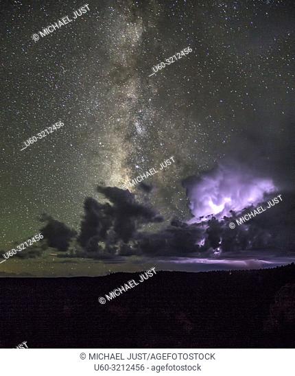 The Milky Way appears during a thunderstorm at The Grand Canyon at Grand Canyon National Park, Arizona
