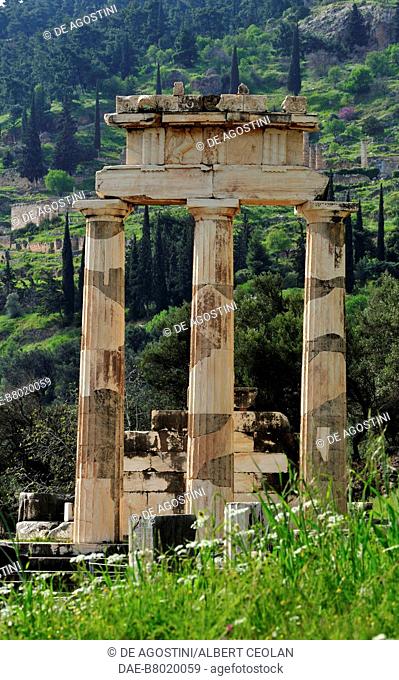 The Tholos columns with the Athenian Treasury and the Temple of Apollo in the background, archaeological site of Delphi (UNESCO World Heritage Site, 1987)