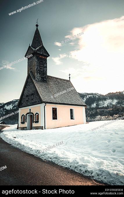Beautiful winter landscape with old church and snow