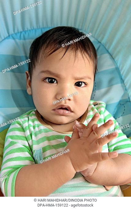 Baby boy with finger crossed MR732