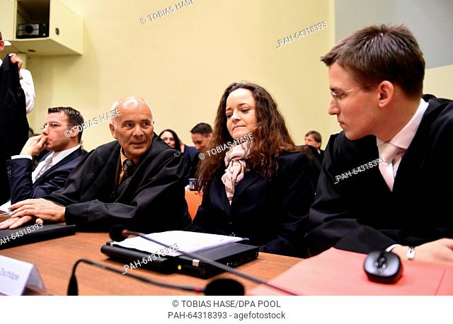 The defendant Beate Zschaepe (2.v.R) and her lawyers Wolfgang Stahl (L-R), Hermann Borchert and Mathias Grasel sit in the courtroom of the higher regional court...